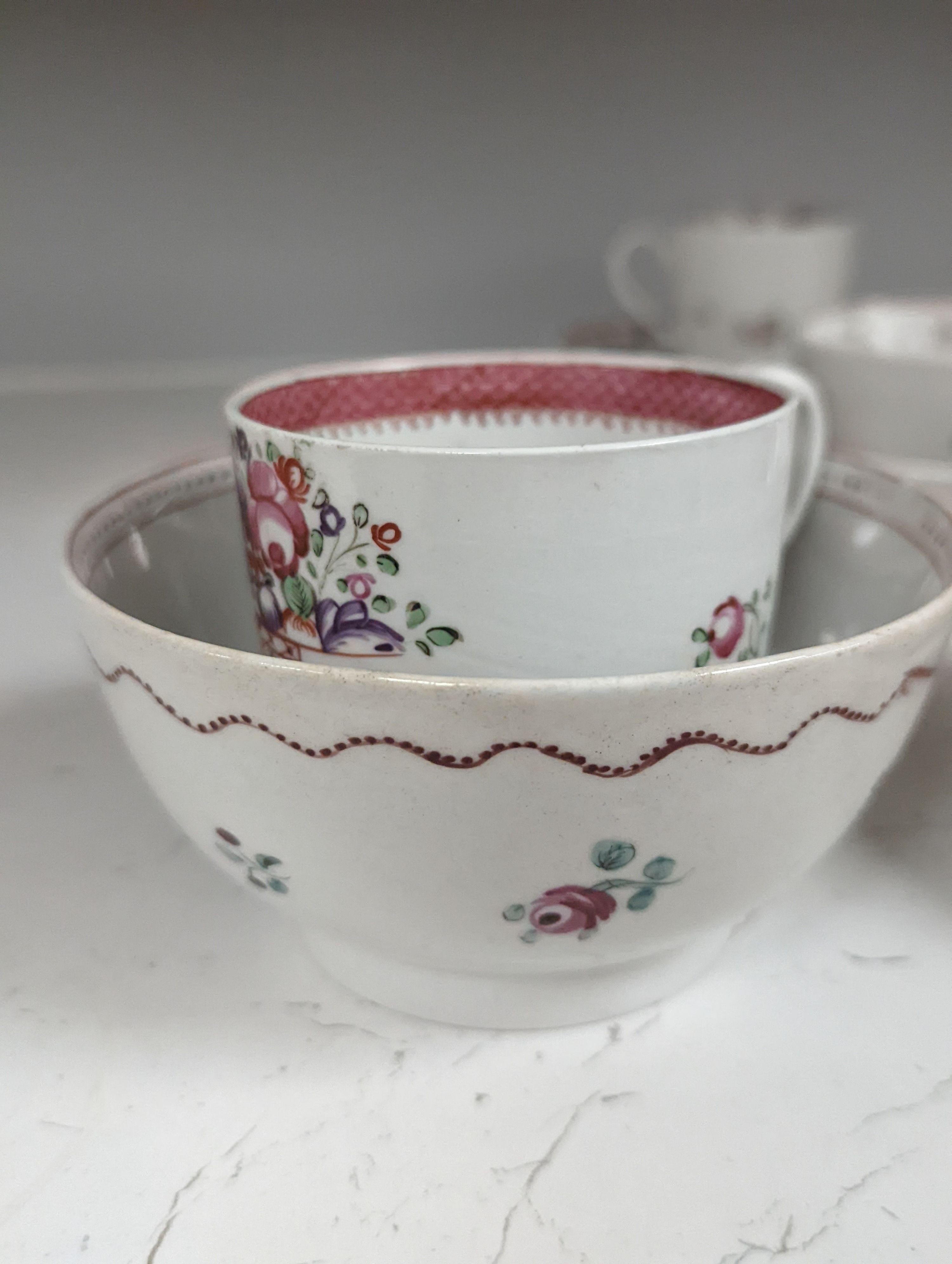 New Hall style study collection: a cream jug pattern 524, a teabowl and saucer with oriental figures, and another teabowl and saucer, a shankered teacup and saucer, two coffee cups, three teabowls, four saucers and a slo